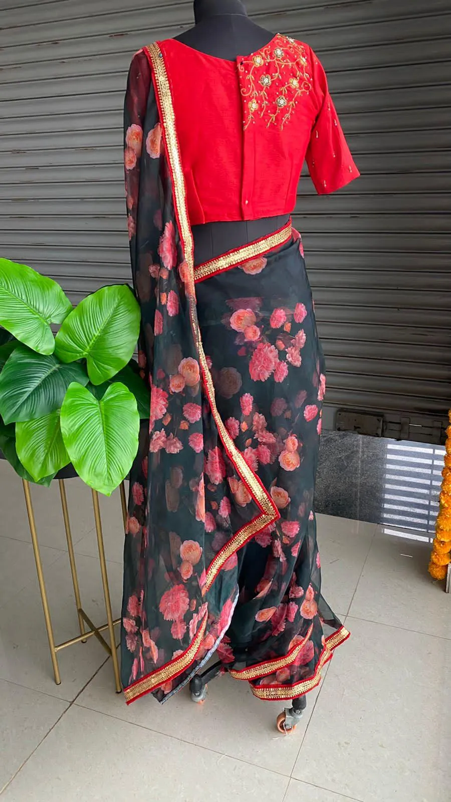 Deep blue floral soft organza saree with hand worked blouse